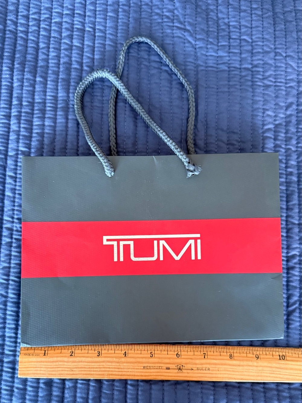 Tumi Black Gift Bag with Red Center Stripe